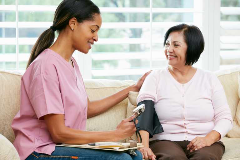 Personal care aide assisting a member